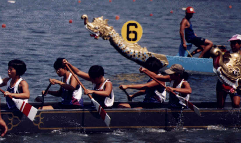 Preparing to race! This is the 12-men crew at the 1997 Jakarta Sea Games. But notice we have to use the full-sized dragonboat for the 12-crew races. For the Singapore Team we are sitting a gap apart on the boat.